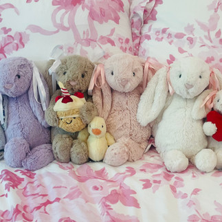 Jellycats on Loveshack Fancy Duvet.