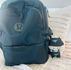 Labubu on a Lululemon Backpack in black.