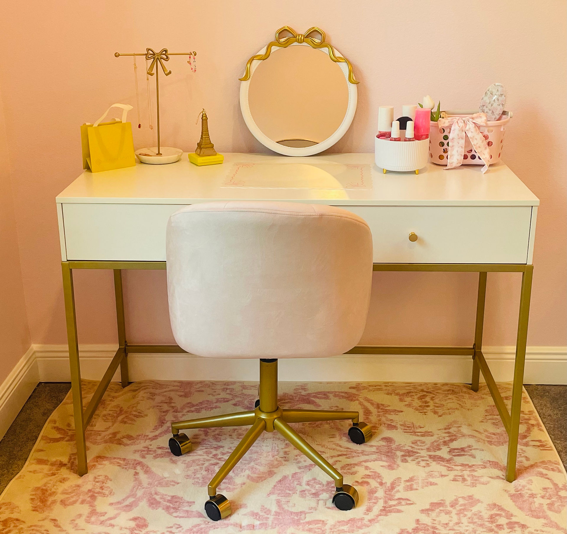Loveshack Fancy vanity with bows, Kendra Scott, and aesthetic pink target basket.