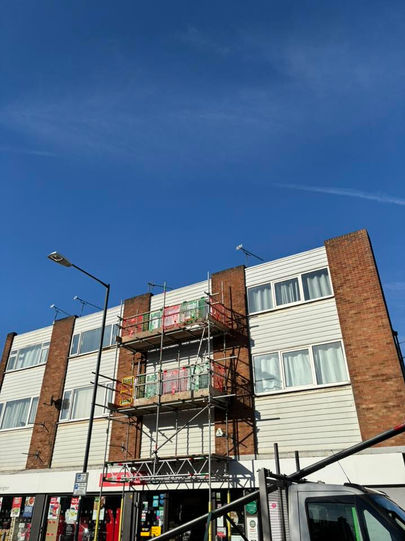 JJP Scaffolding Services Ltd erecting a sturdy scaffolding structure around an apartment building in Bedworth, Warwickshire, providing safe access for construction and maintenance work.