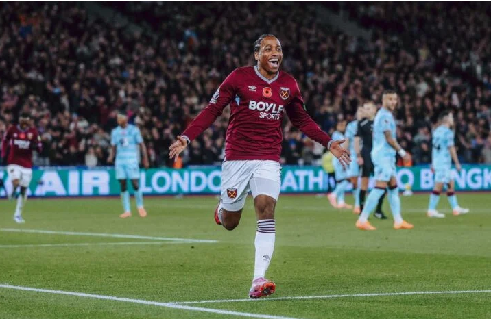 West Ham United football stadium with AI data analytics overlay, highlighting generative AI scouting platform collaboration with AWS and Crayon.