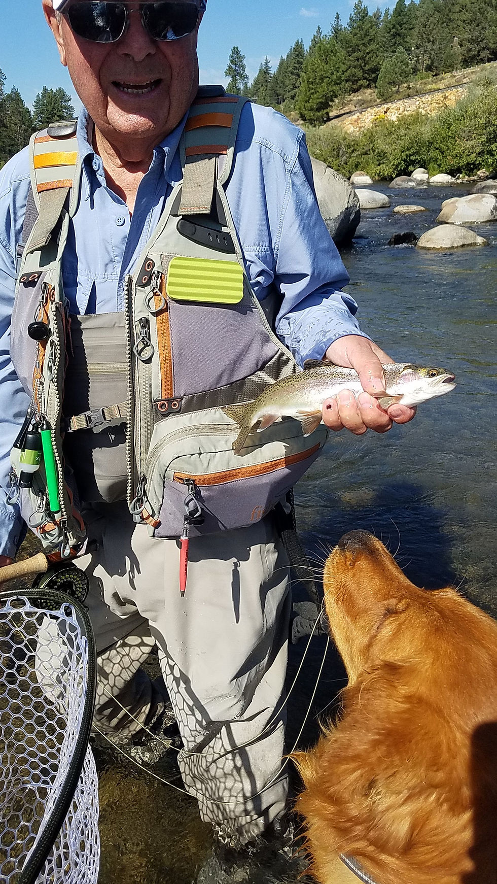 Angler with rainbow trout
