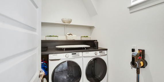 Laundry room with high-end washer and dryer.