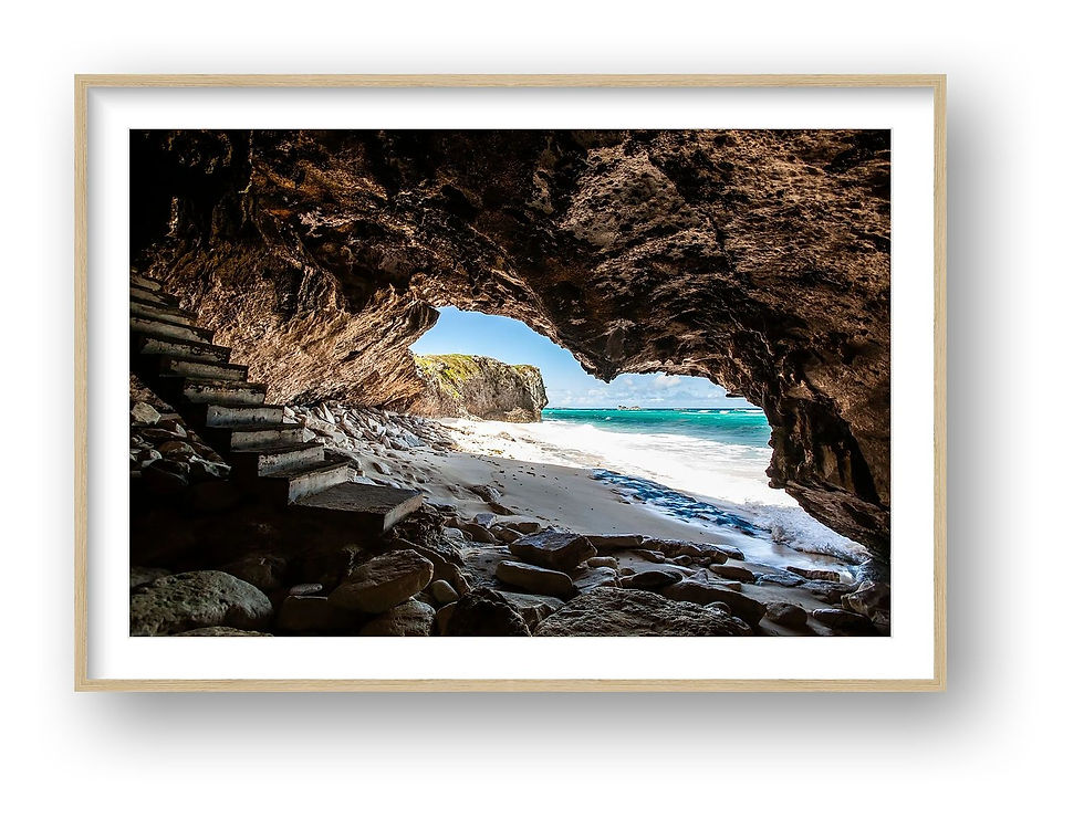 Thumbnail: Limestone sea cave framing turquoise Caribbean water and white sand beach in Turks and Caicos tropical coastal landscape phot