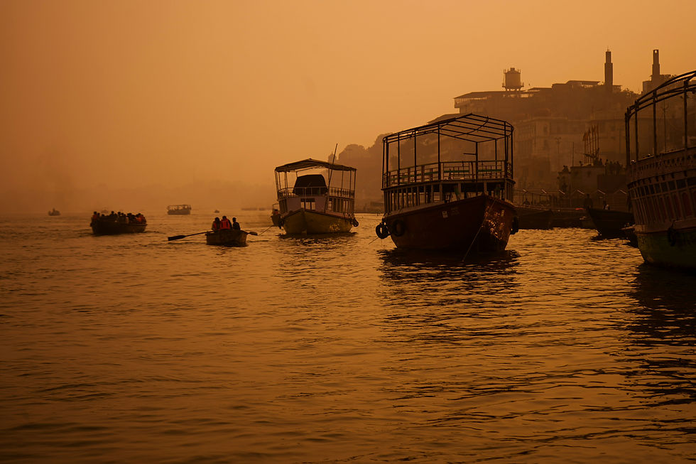 Eye-level view of the Ganges river with ancient ghats in Varanasi