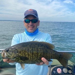 Man on guided fishing trip at Fish Ohio Outfitters holding a fish