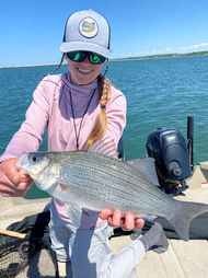 Woman holding a fishing on Lake Erie at Fish Ohio Outfitters