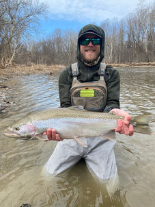 Man on guided fishing trip at Fish Ohio Outfitters holding a fish