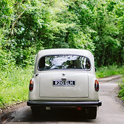 White London Taxi wedding car driving down a country lane