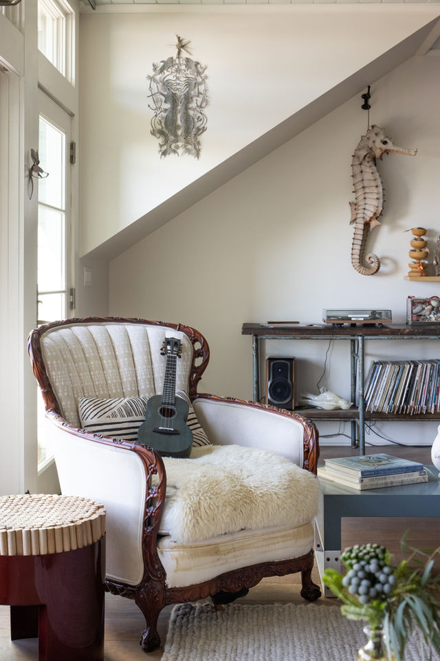 Heirloom victorian bergere lounge chair in eclectic coastal living room.