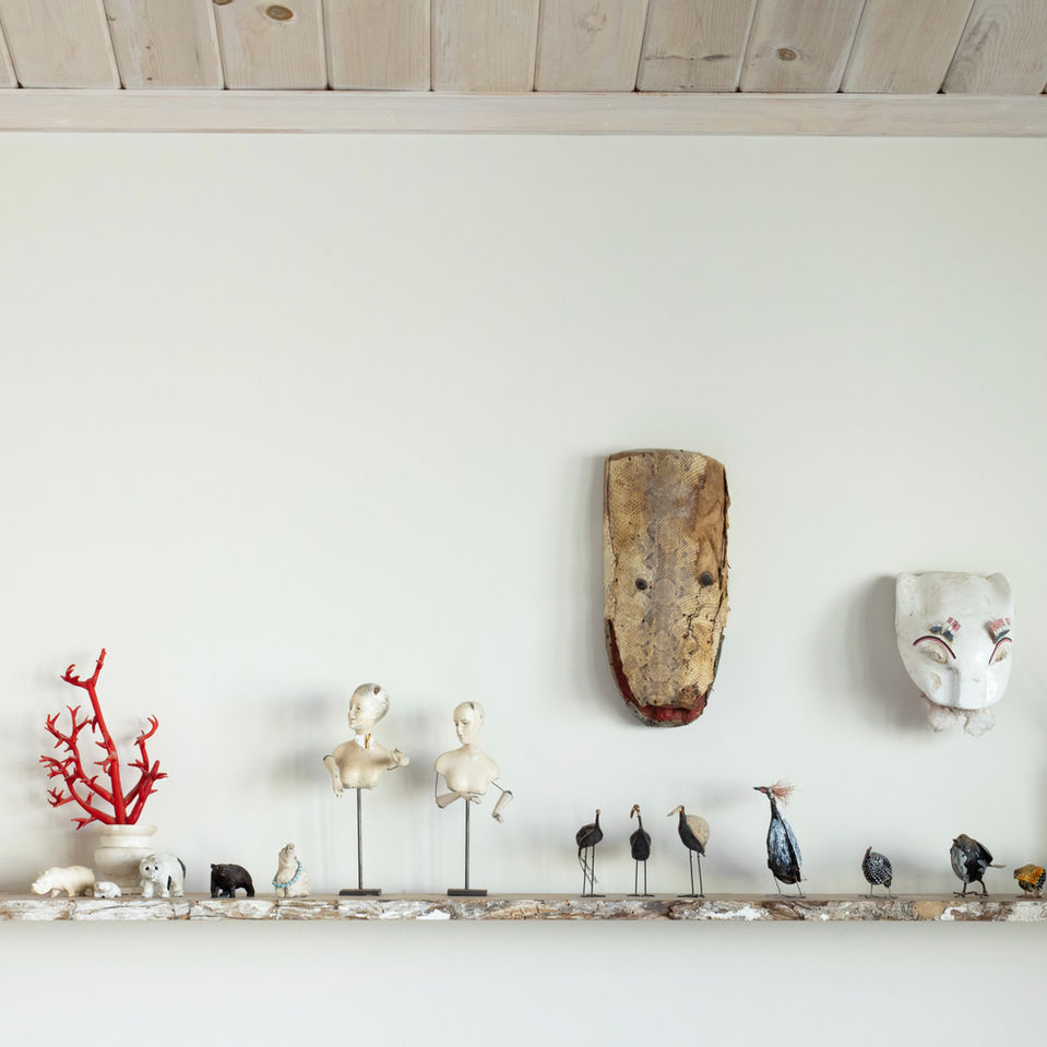 Curated & Collected Shelf Styled with folk art animal figures from world travel