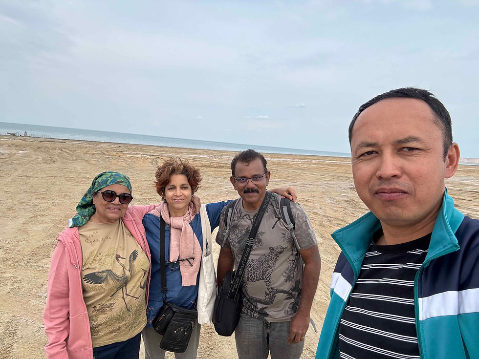 Left to right: Sheila, Bharati, me, and our driver Rasul at the Aral Sea