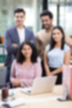 successful-business-people-posing-together-office