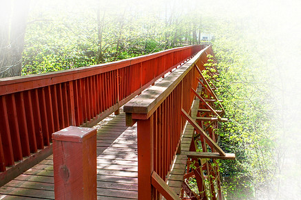 Image of red wooden footbridge