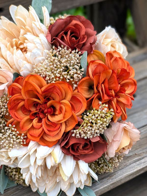 Eco Amber eco friendly faux bridal bouquet featuring amber, cream and caramel recycled flowers.
