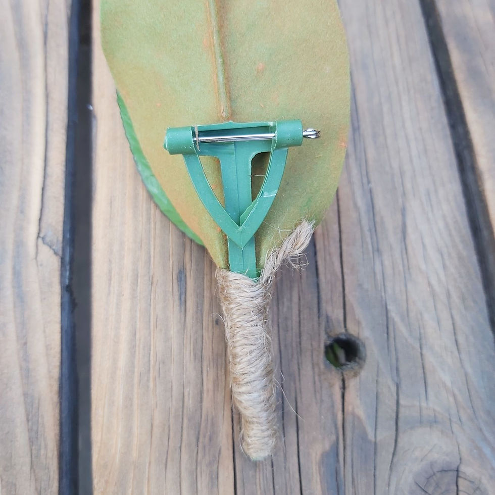 Thumbnail: Sweet Magnolia faux buttonhole with cream magnolia petal and green foliage – artificial wedding suit flower