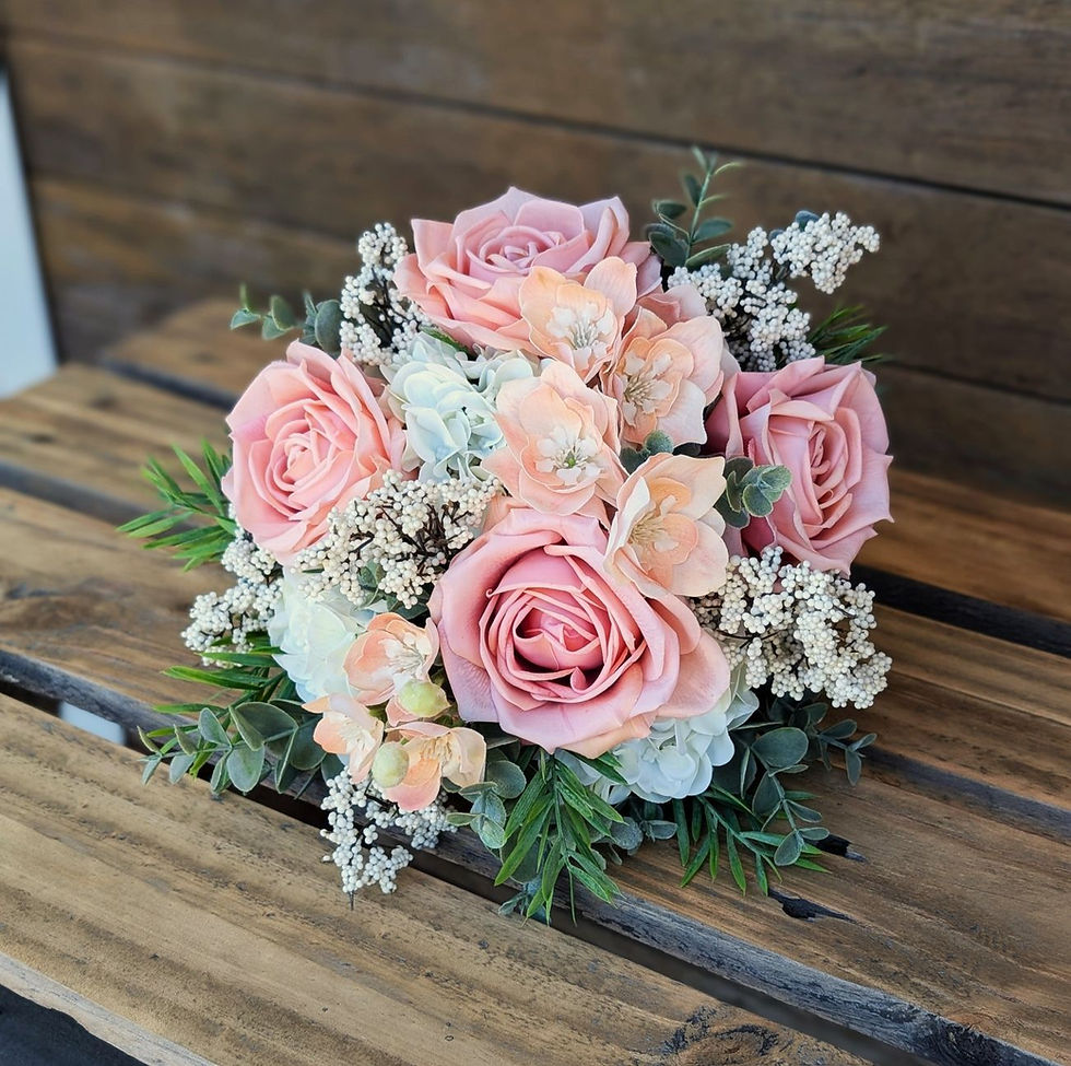 Peaches and cream bridesmaid bouquet with soft peach roses and neutral tones