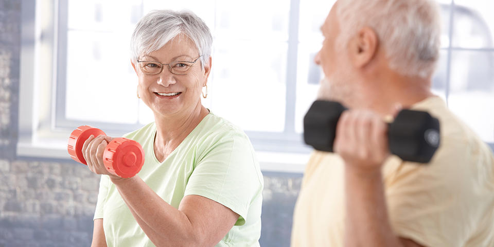 old people lifting dumbbells