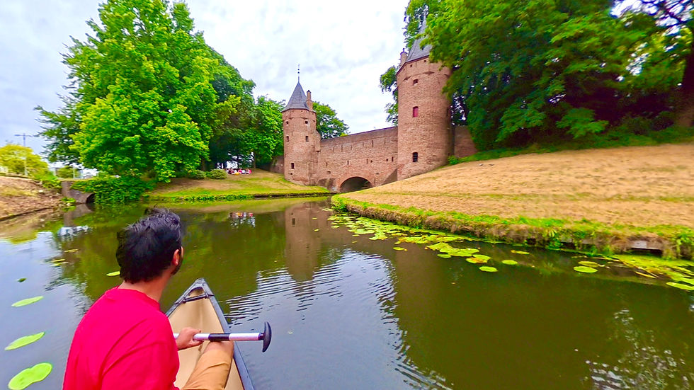 View of Monnikendam Waterpoort in Amersfoort from a boat on the canal