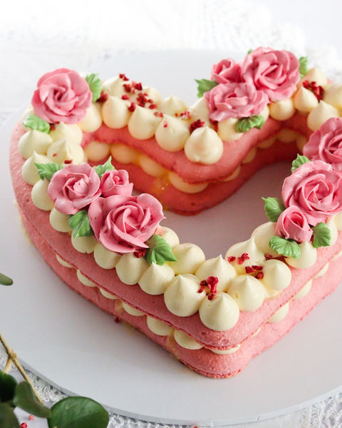 Large pink Valentine heart layered macaron cake