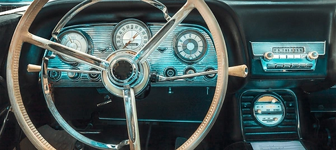 Antique car speedometer redline and steering wheel