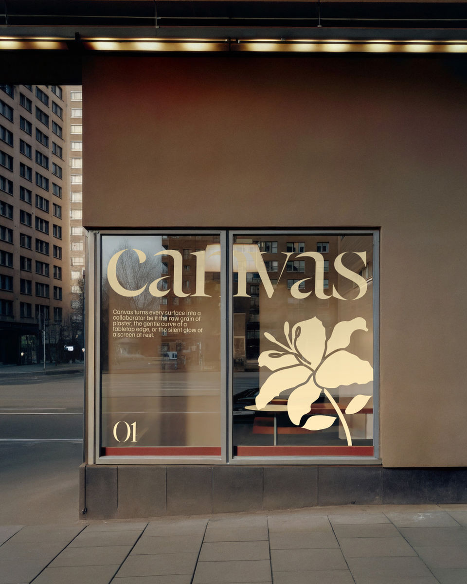 A high-fidelity facade mockup featuring a retail window with botanical vinyl branding under warm urban evening light.