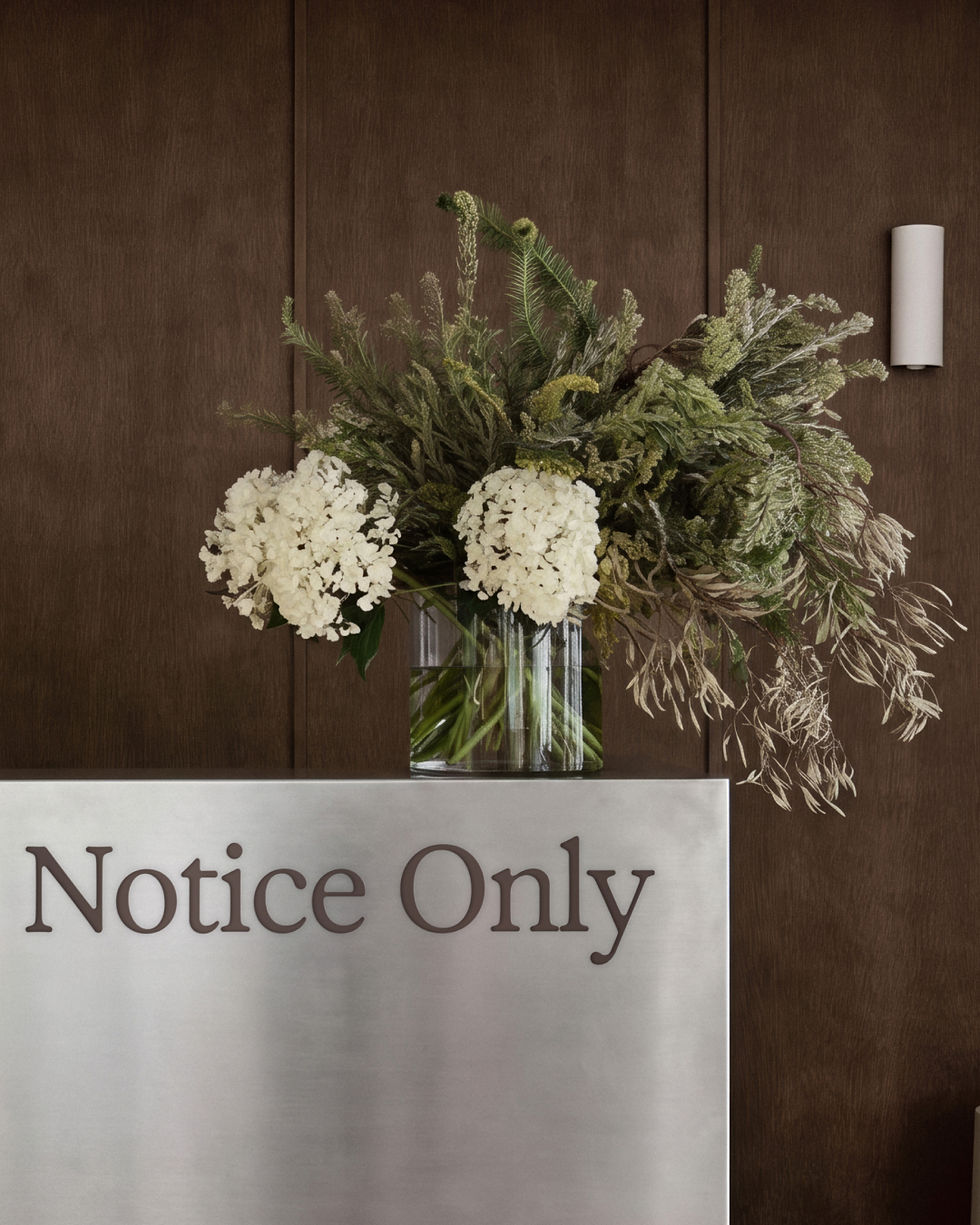 Close-up reception counter mockup with typography on brushed metal