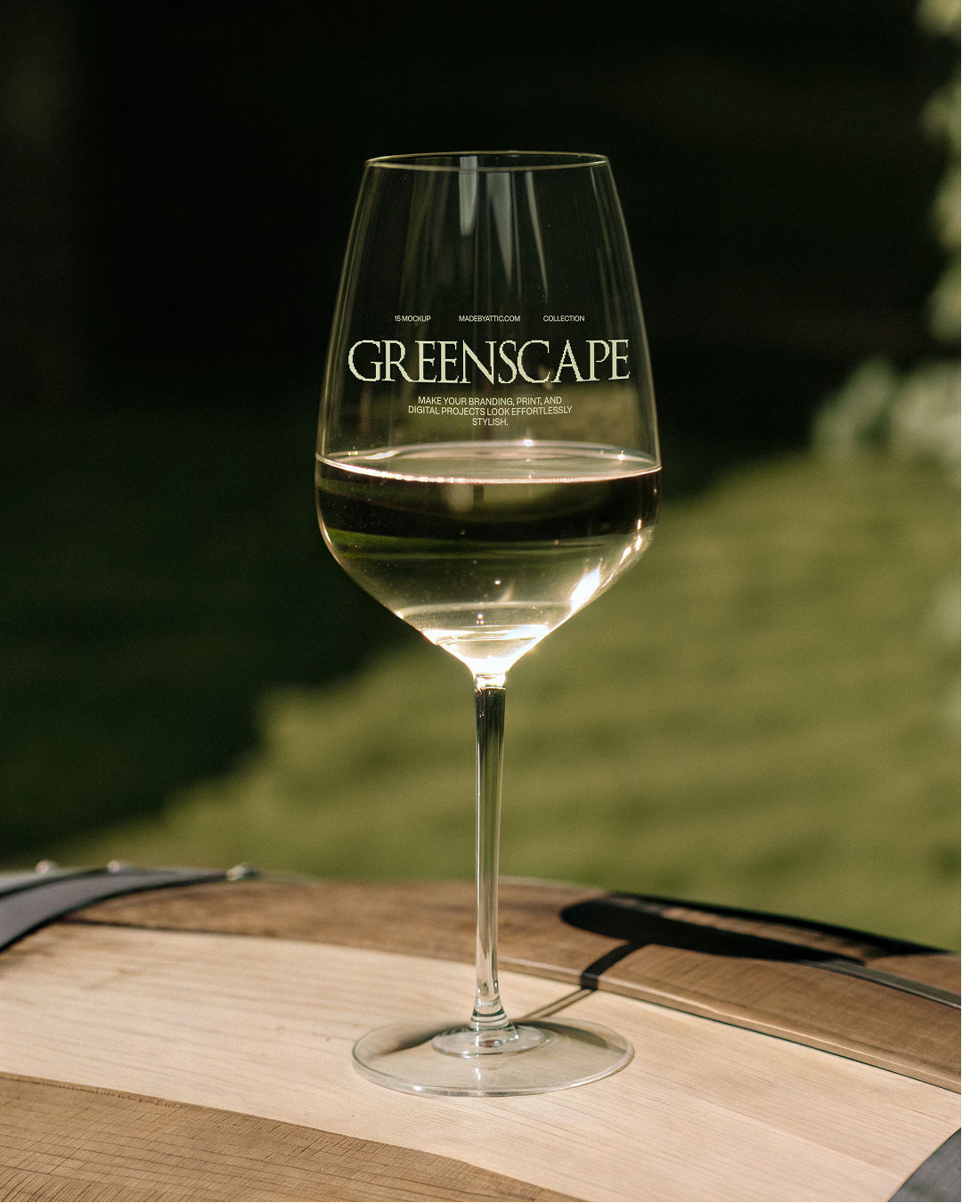 wine glass mockup, white wine, wooden barrel, dark green garden, vineyard, outdoor glassware mockup, made by attic