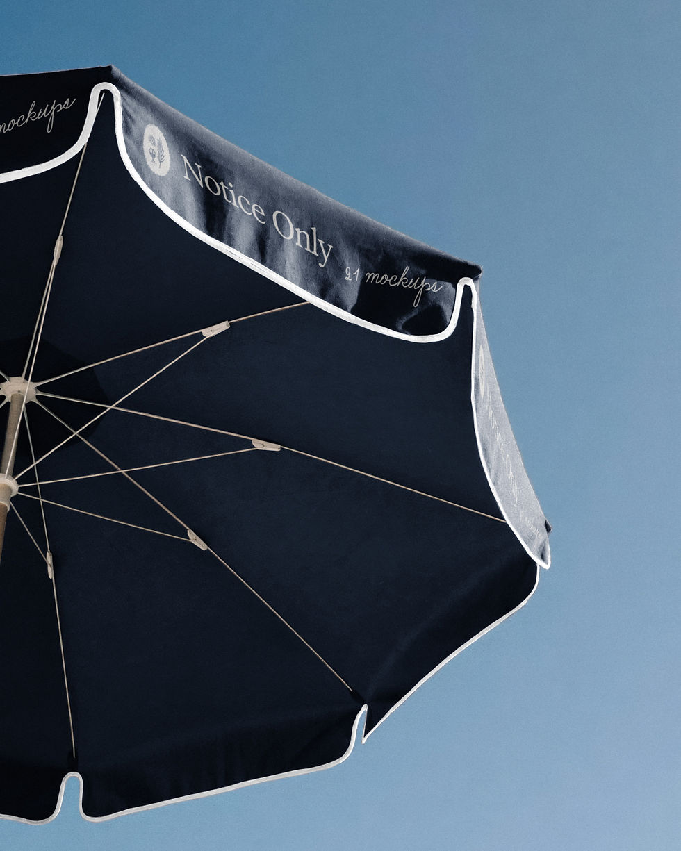 beach parasol mockup, umbrella canopy from below, branded valance, blue sky, tan blue and espresso colourways, hospitality br
