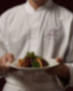 chef jacket mockup, white chef coat, plated dish, fine dining, burgundy background, hospitality branding mockup, made by atti