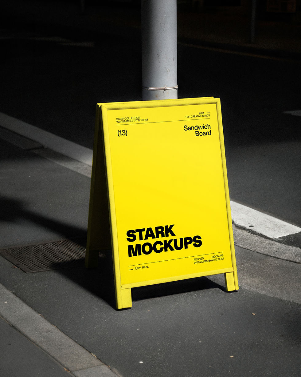 A high-fidelity urban sandwich board mockup featuring a white A-frame sign on a dark urban sidewalk under sharp sunlight.