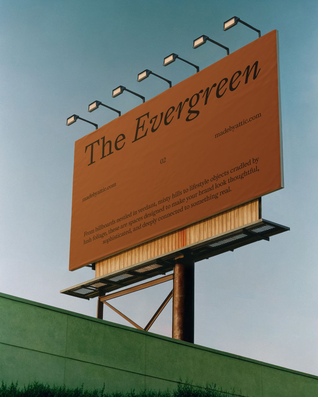 A high fidelity billboard mockup on a monumental steel frame under a clear sky with industrial lighting fixtures.