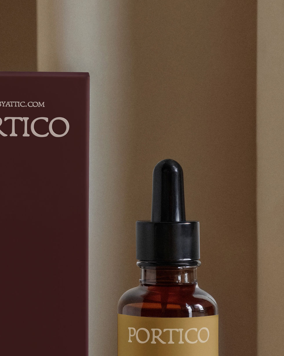 Thumbnail: A high-fidelity dropper bottle and box mockup on a warm timber surface with a single tulip bowing over the scene.