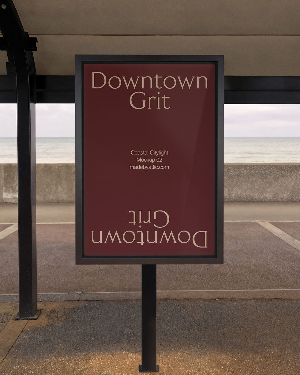 A high fidelity citylight mockup in a black frame under an urban shelter with the sea and a muted sky in the background.