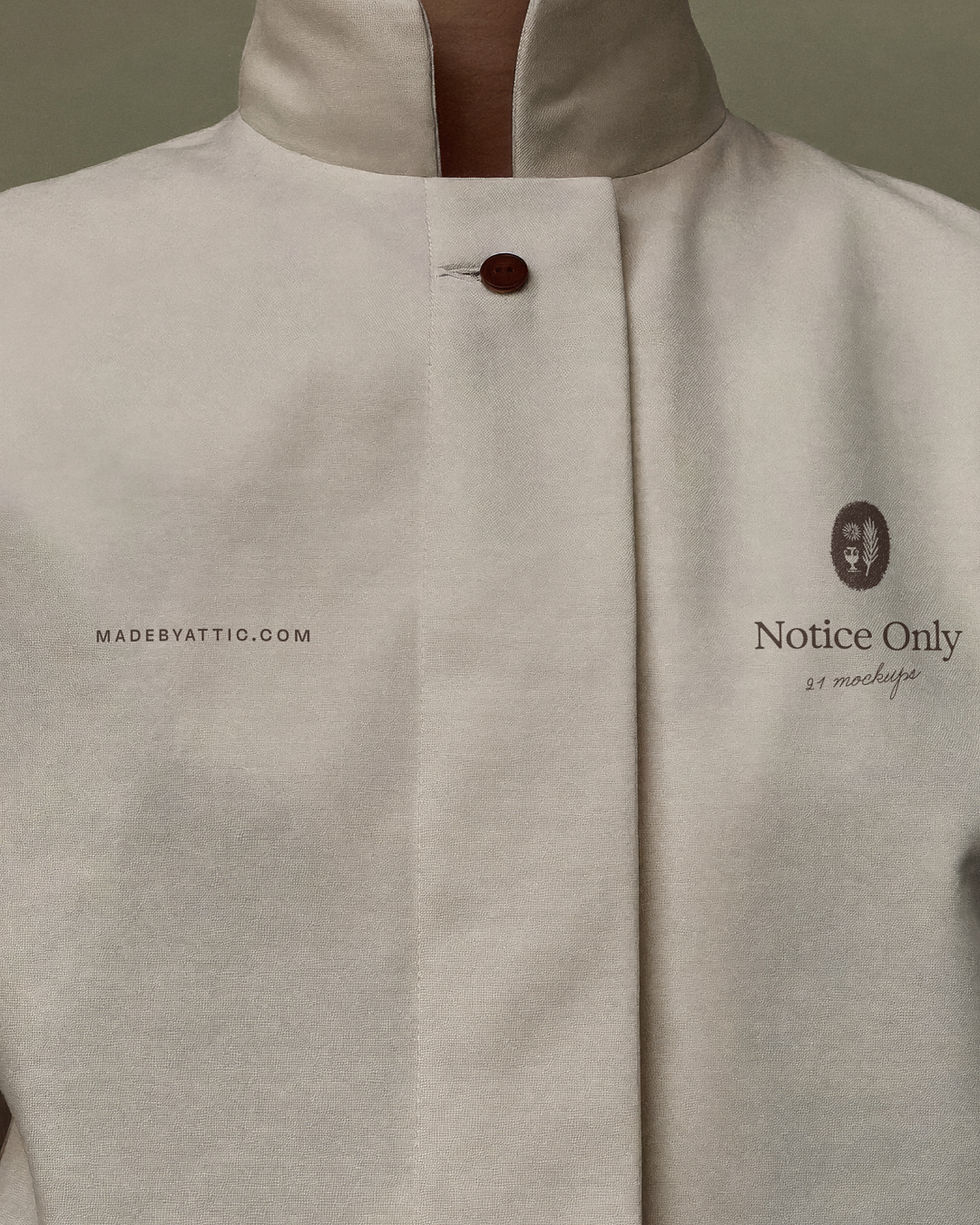 Cream hospitality uniform mockup with chest logo on structured jacket