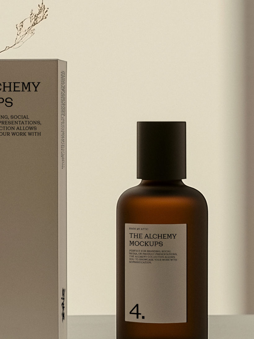 Amber glass bottle standing next to a tall white packaging box on a podium with dried flowers in the background.