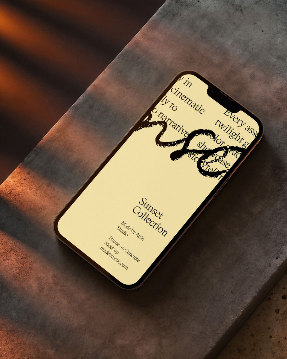 Smartphone screen mockup lying on a grey concrete block with sharp diagonal sunset shadows.