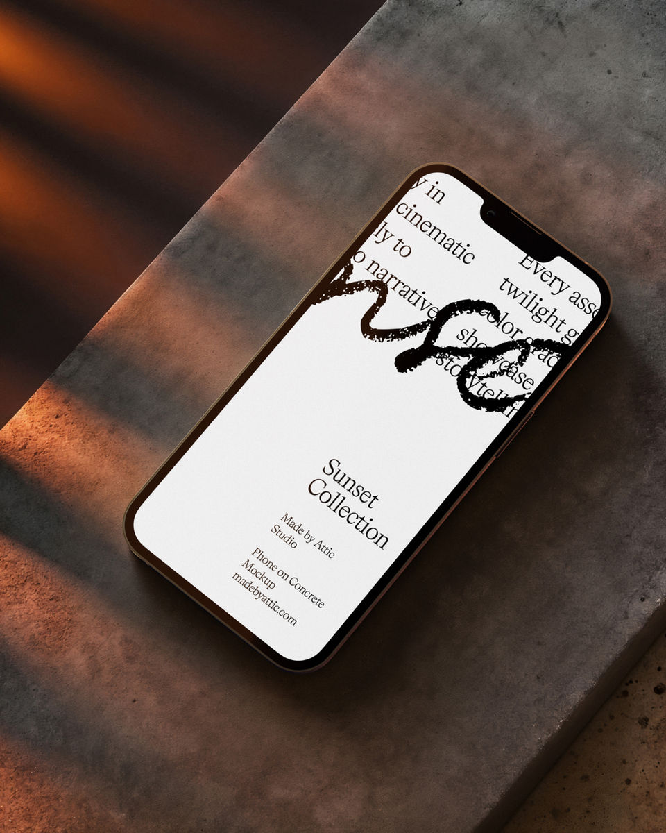 Smartphone screen mockup lying on a grey concrete block with sharp diagonal sunset shadows.