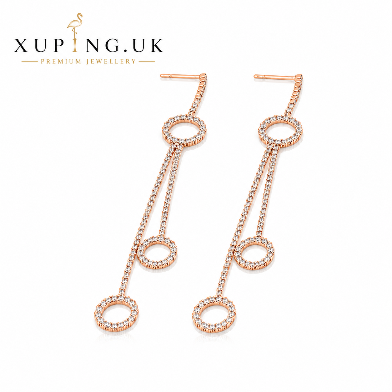 18ct gold plated long drop earrings with white cubic zirconia on a white background.