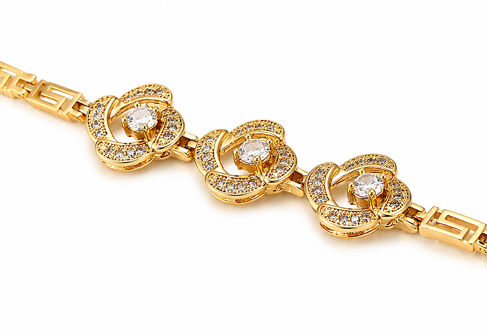 Close-up of gold plated flower charm bracelet with sparkling crystal details