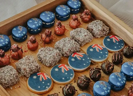 Macarons, lamingtons, and cookies with Australian flags.