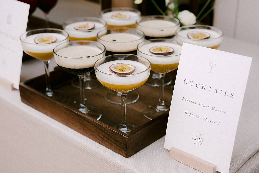 A small wedding cocktail sign with two choices of cocktails and an illustration of a cocktail