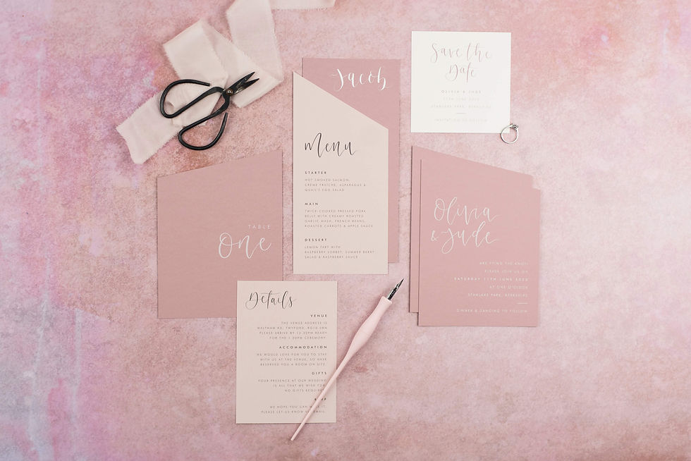 Wedding stationery collection in shades of pink with modern calligraphy and angled edges