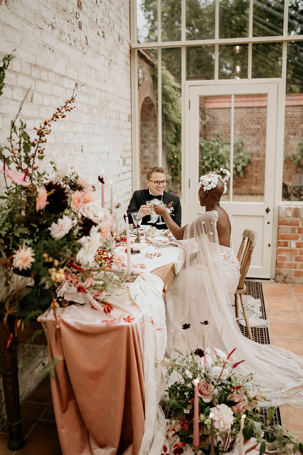 The happy bride and groom toasting their glasses