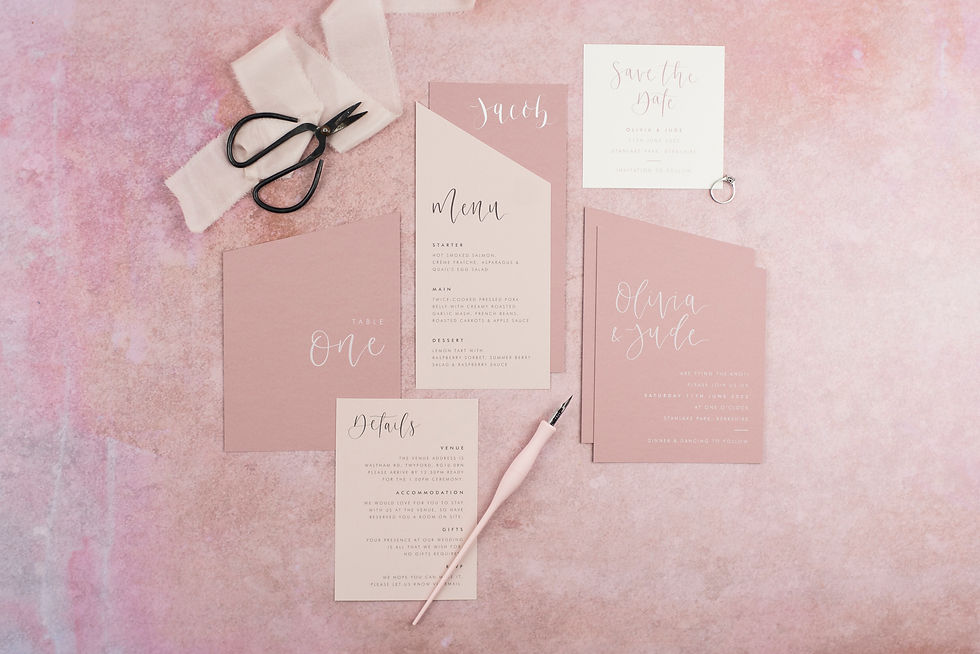 Wedding stationery collection on pale pink and white card with shaped angles for a contemporary look.