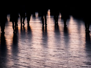 A group of people walking forward