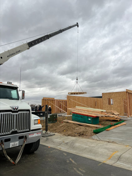 Boomer Crane Service assisting with residential construction project