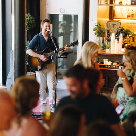 Ken Jones singing and playing guitar at a wedding ceremony in Dublin
© Violetsareblueweddings