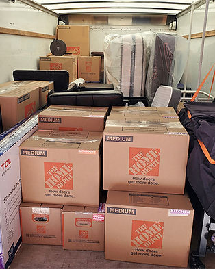 moving boxes loaded in a moving truck by Beaver Town Movers moving helpers