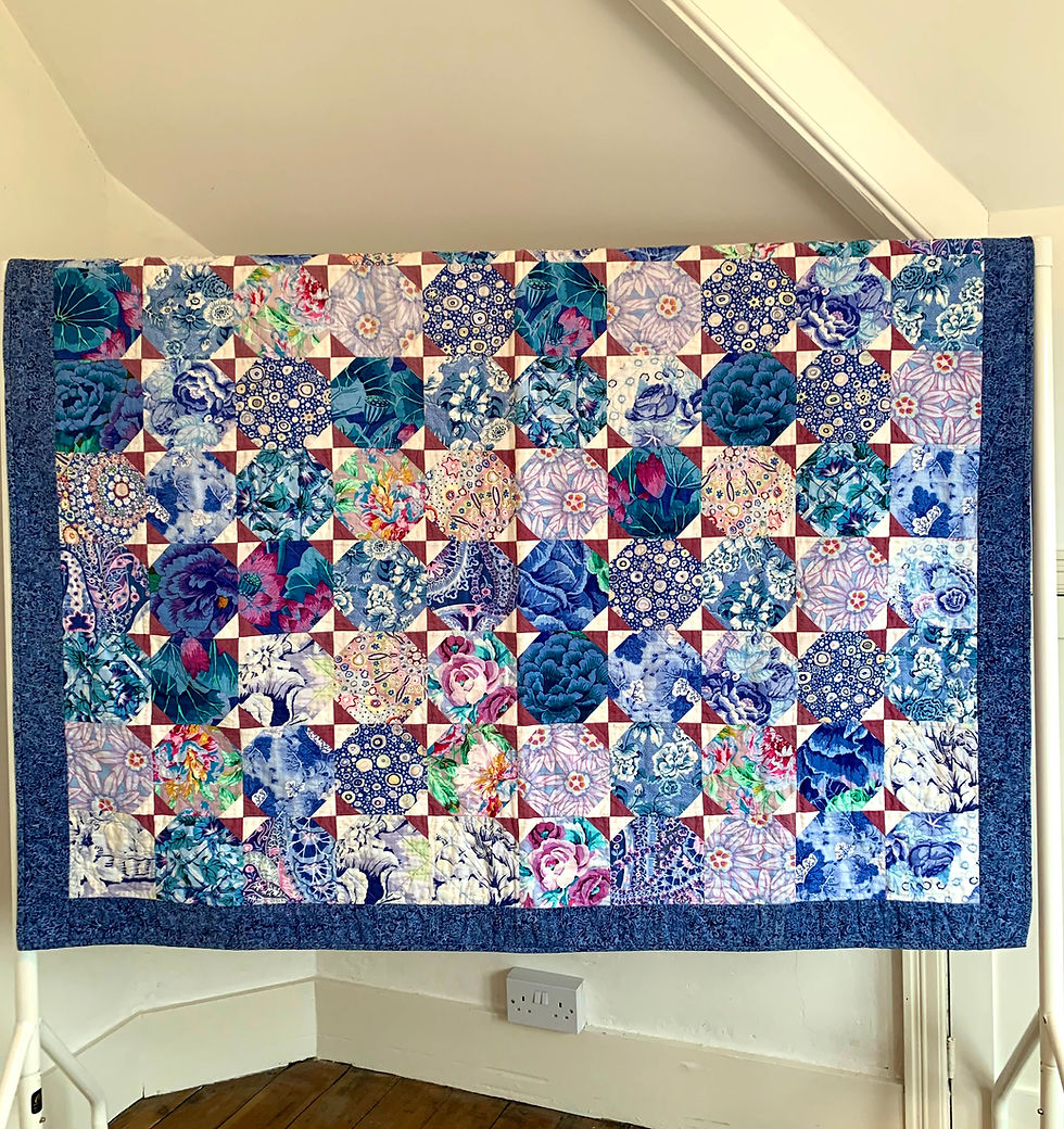 Thumbnail: Snow ball quilt block made in blue Kaffe Fassett fabrics